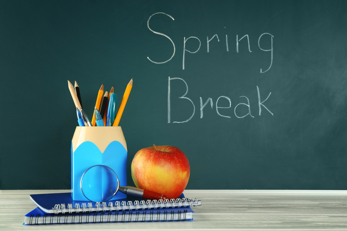 School Stationery and "Spring Break" Text on Chalkboard